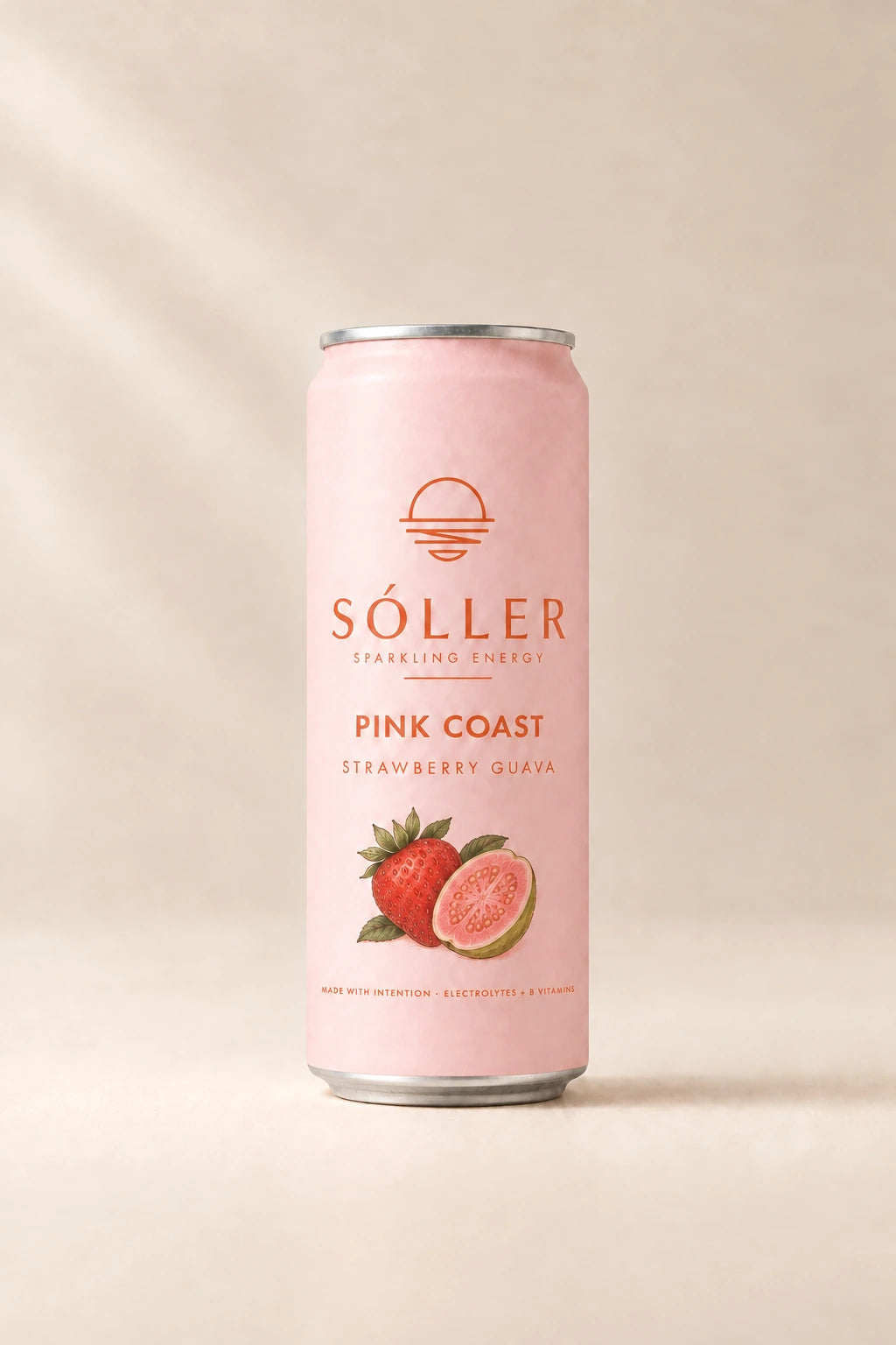 Sóller Pink Coast can — strawberry guava — on a travertine ledge with fresh guava and strawberries
